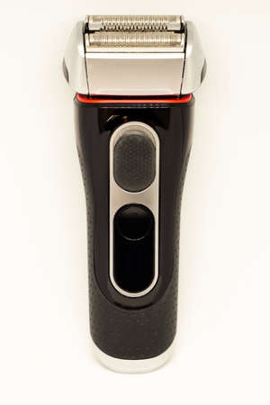 Battery powered man shaver on white isolated backgroundの写真素材