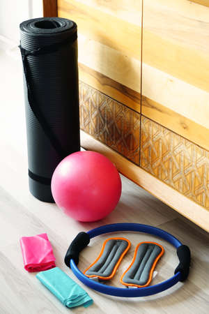 Pilates set with foot weighs stretch ball and mat at homeの写真素材