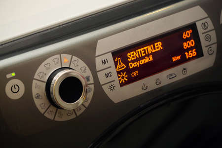 Electronic washing machine with scrolling dial and lcd screen close up viewの写真素材