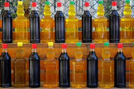 Farmers market in Bursa Turkey selling homemade pickles olive oil herbs close up viewの写真素材