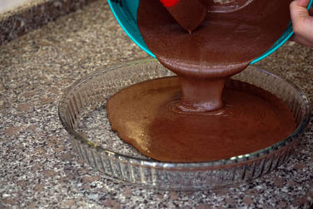 Preparing brownie cake at home with mixer whisk and oven processesの写真素材
