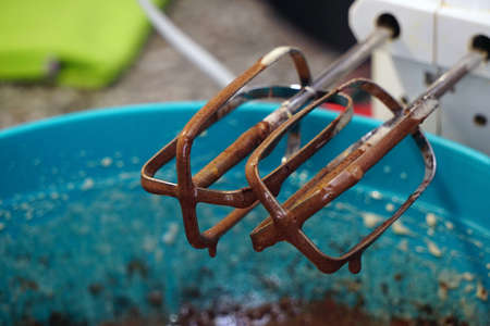 Preparing brownie cake at home with mixer whisk and oven processesの写真素材