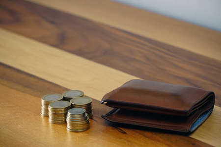 Turkish coin liras and purse on wooden background cleavage for the text availableの写真素材