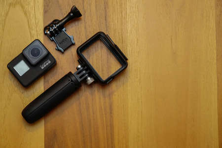 16 May 2019 Eskisehir, Turkey. Gopro 7 black assorted accessories on wooden background;