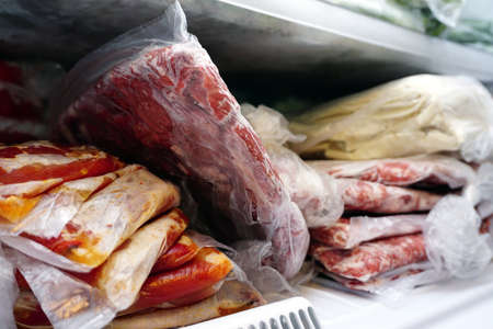 Frozen meat and vegetables in the deep freezeの写真素材