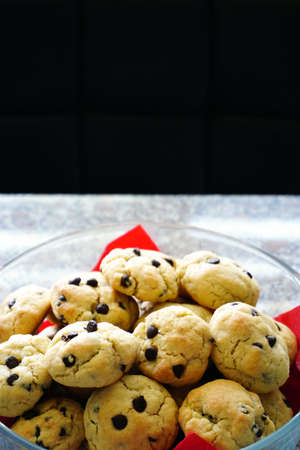 Chocolate chip cookie in hand close up view