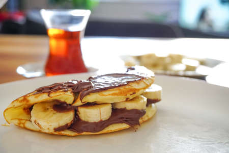 Homemade pancake hazelnut cream and jam breakfast dessertの写真素材