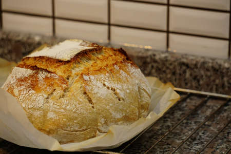 Sour yeast artisan home made baked bread in the kitchenの写真素材