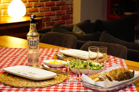 10 October 2020 Eskisehir Turkey. Yeni Raki Turkish raki and roasted bonito fish on the tableのeditorial素材