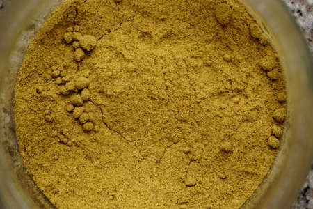 Powdered cummin spice in the jar close up viewの写真素材