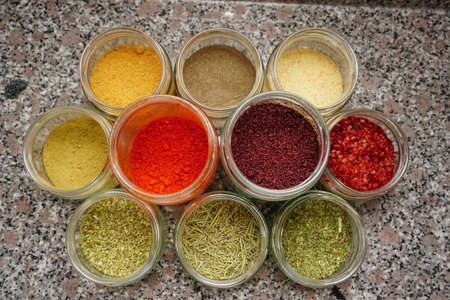 Assorted seasoning spice in the jars in the kitchen close up viewの写真素材