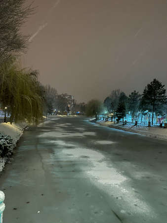 Frozen Porsuk river in Eskisehir at Kanlikavak park at night snow scenesの写真素材