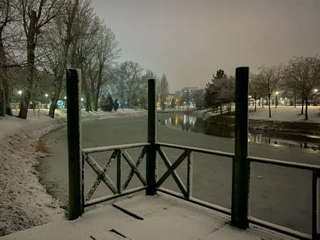 Frozen Porsuk river in Eskisehir at Kanlikavak park at night snow scenesの写真素材