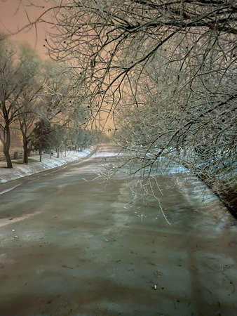 Frozen Porsuk river in Eskisehir at Kanlikavak park at night snow scenesの写真素材