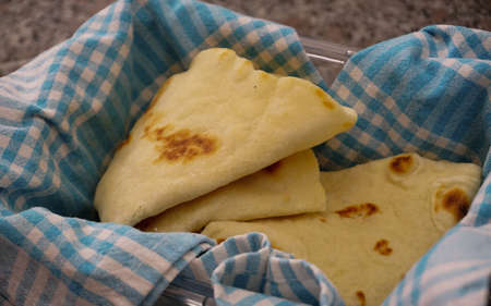 Hand made lavash bread and Turkish breakfast on wooden table