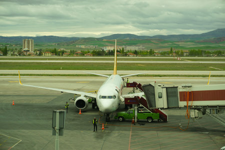 7 May 2022 Ankara Turkey. Boarding Pegasus airlines plane with ramp on Esenboga airportのeditorial素材