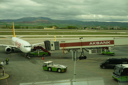 7 May 2022 Ankara Turkey. Boarding Pegasus airlines plane on Esenboga airportのeditorial素材