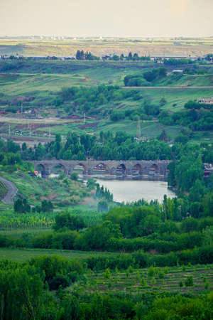 8 May 2022 Diyarbakir Turkey. Ten eyed ongozlu bridge on Dicle river in Diyarbakir view from City wallsの写真素材