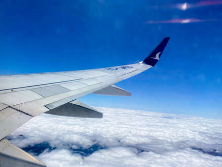 Airplane wings above cloudsのeditorial素材
