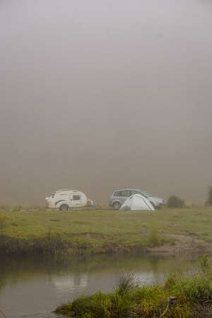 14 August 2022 Eskisehir Turkey Camping in the nature on a foggy morning with caretta caravanの写真素材