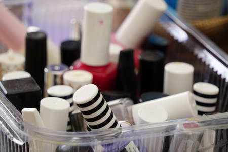 Nail polishers in transparent box close up viewの写真素材