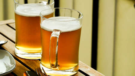 Two pints of homemade beer close up viewの写真素材