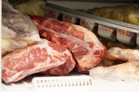 Frozen meat in the fridge close up viewの写真素材