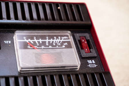 Car battery charger close up view on isolated backgroundの写真素材