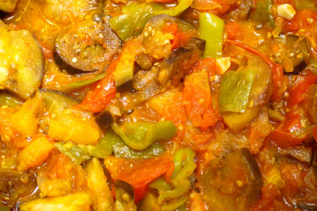 Roasted vegetables with tomato sauce in the dish close up viewの写真素材