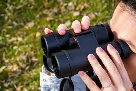 29 October 2023 Eskisehir Turkey. Woman observing bird with binoculars close up viewの写真素材