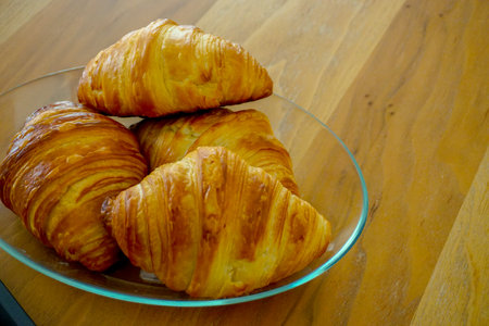 Croissant and coffee breakfast appetizers close up viewの写真素材