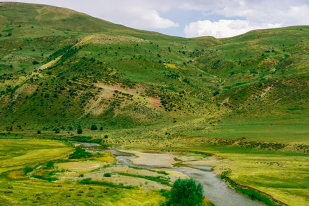 Beautiful Scenic Meadows and Fields in Erzurum district in Turkey on a cloudy dayの写真素材