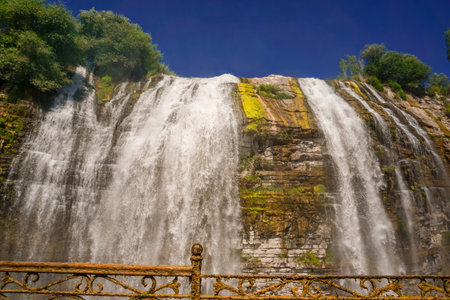 14 July 2025 Tortum Erzurum. Tortum waterfall, tortum dam, lake and fish farms on the lake on a sunny day.の写真素材