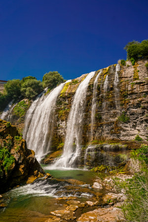 14 July 2025 Tortum Erzurum. Tortum waterfall, tortum dam, lake and fish farms on the lake on a sunny day.の写真素材