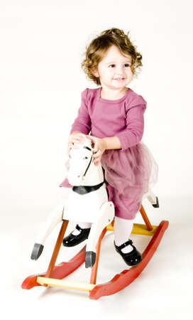 Baby Rocking on Horseの写真素材