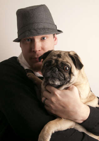Man Holding Pugの写真素材