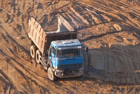 The work of the dump truck on a construction site on the Foundation of the building の写真素材