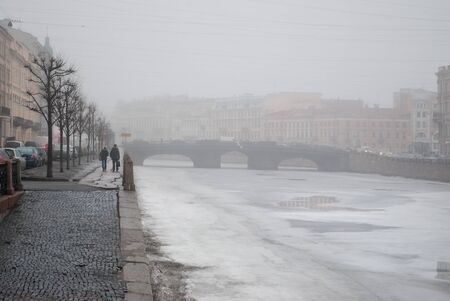 Fog on the embankment of the Neva River in the early morning in February in the city of Saint Petersburg.の写真素材