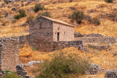 Stone church in the ruins of an ancient ruined fortress Acrocorinth on a hot sunny day.のeditorial素材