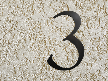 Made of chrome-plated metal figure three reinforced wall beige.の写真素材