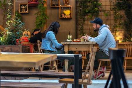 Budapest, Hungary, July 01: A couple of young people are having supper in one of the many cafes in the city of Budapest on July 01, 2018.のeditorial素材