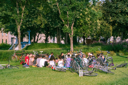 Budapest, Hungary, July 5: A group of young cyclists is resting in a public garden on the Danube embankment in the city of Budapest on July 5, 2018.のeditorial素材