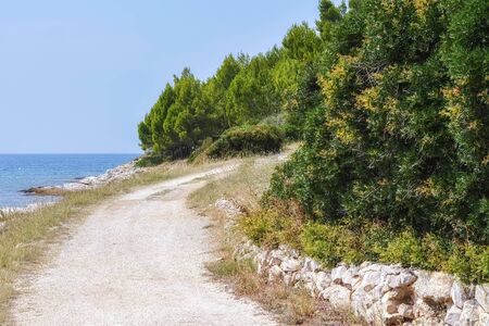 Footpath for outdoor hiking along the seashore on the Red Island in Croatia.の写真素材