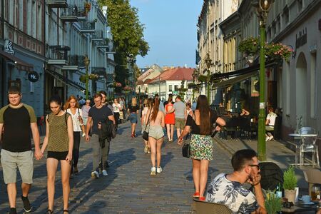 Kaunas, Lithuania, August 30: Citizens and tourists stroll along Vilnius street and relax in cozy cafes in the evening in the old part of Kaunas on August 30, 2019.のeditorial素材