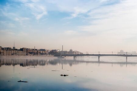 Urban landscape of an early March morning in Saint Petersburg, with a light haze over the river Neva.の写真素材