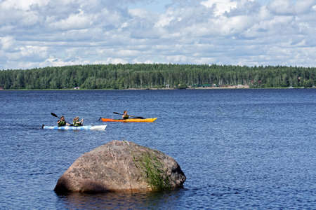 Vyborg, Russia, July 9: Tourists in two kayaks float on a lake in Mon Repos Park in the city of Vyborg, July 9, 2020.のeditorial素材