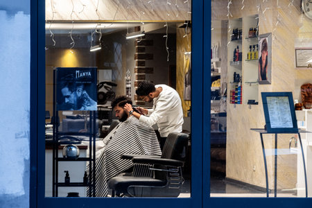 Dresden, Germany, December 27. A man gets a haircut at a hairdresser in the Neustadt district of Dresden on December 27, 2023.のeditorial素材