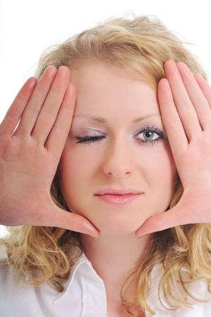 beautiful woman face framed with hands isolated on whiteの写真素材