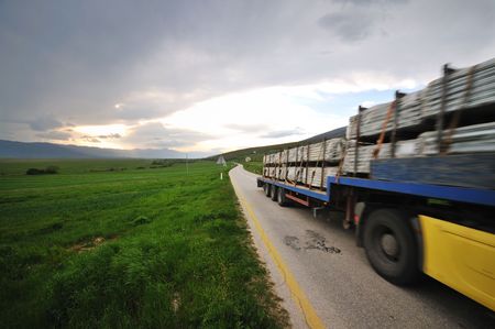 big truck drive on long country roadの写真素材