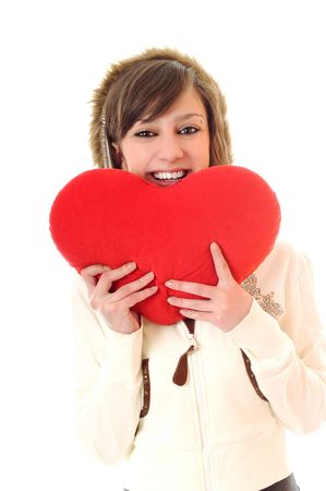 happy young woman with heart isolated on whiteの写真素材
